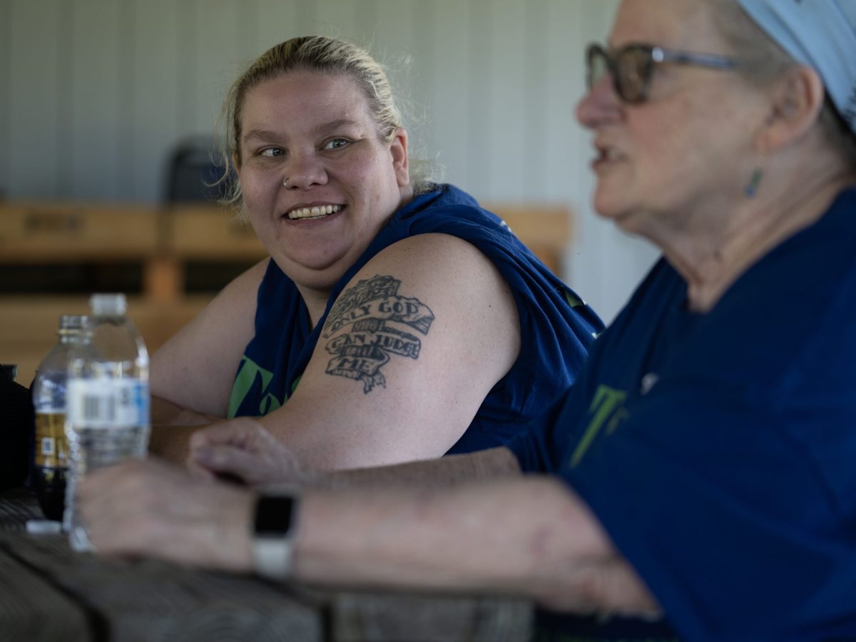 Tanya Robinson talks with supporters.