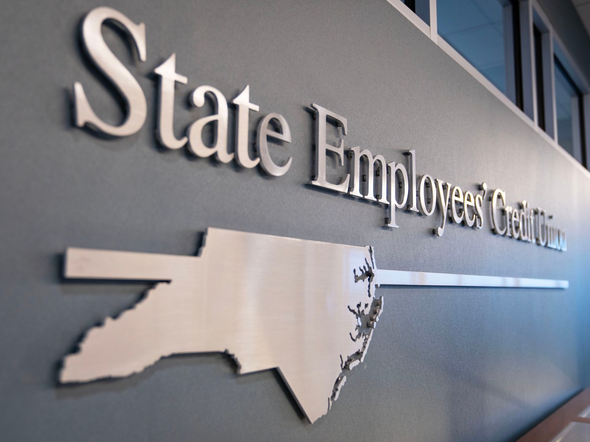 sign that reads "state employee credit union" with shape of North Carolina