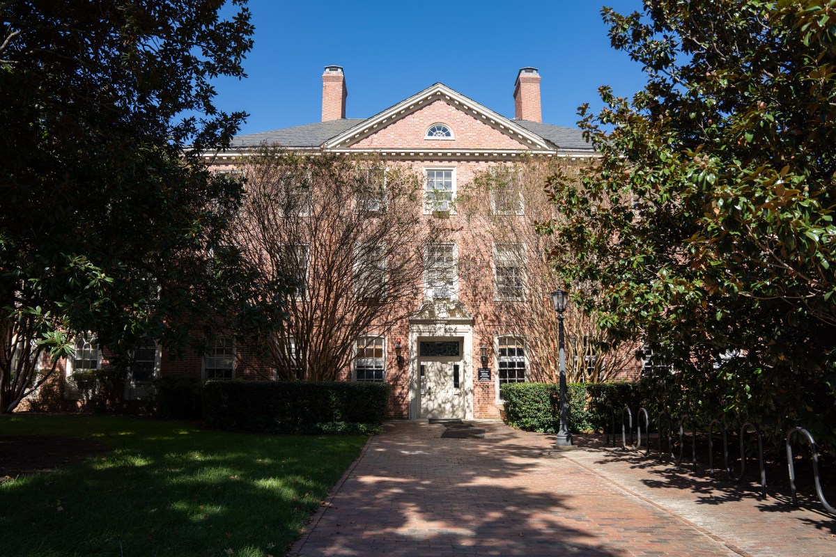 A brick building with trees in front