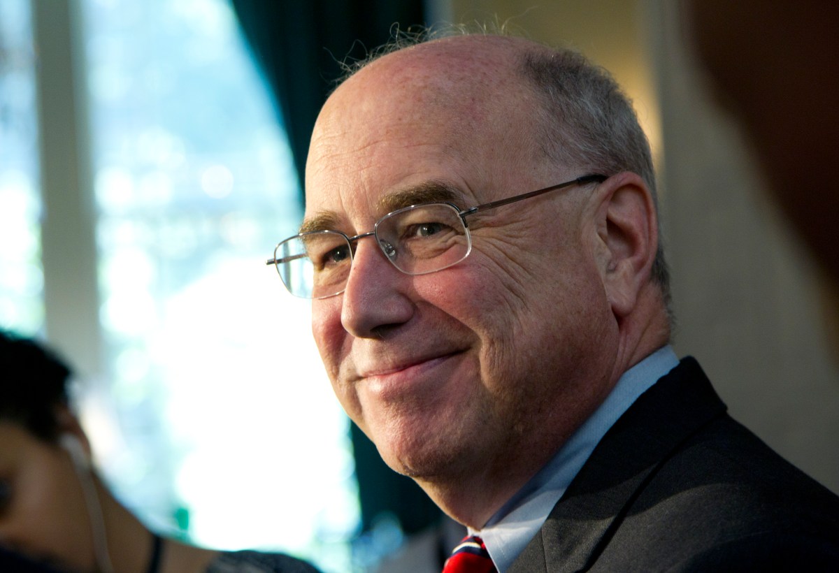 A man in glasses smiling