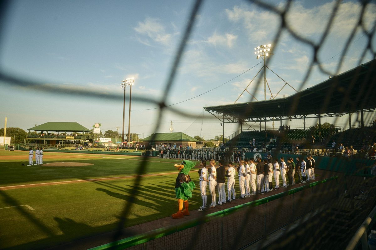 wood duck mascot and team stand for national anthem